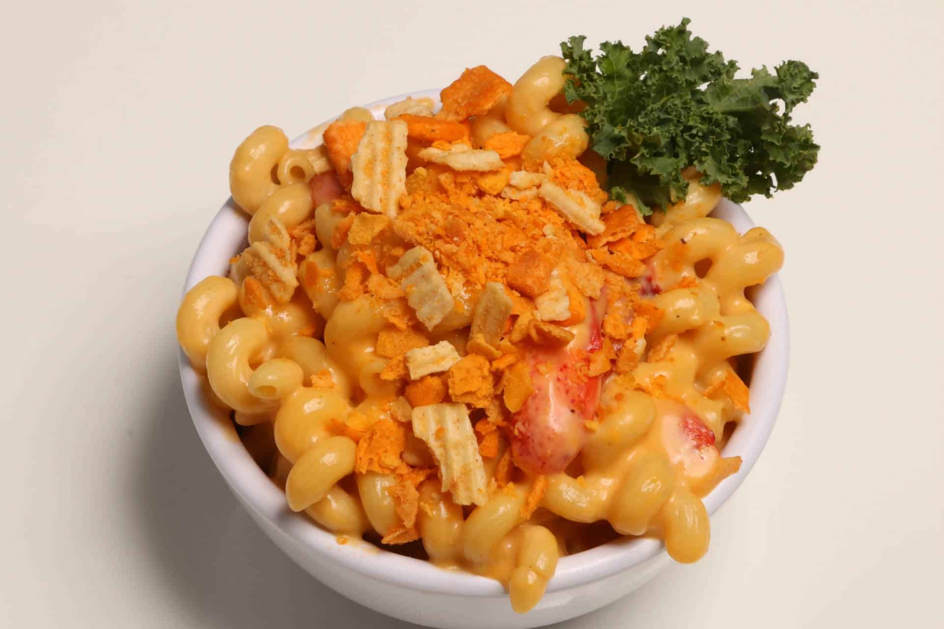 Shrimp Mac and Cheese with Topping Creamy shrimp mac and cheese topped with crushed crackers and parsley.