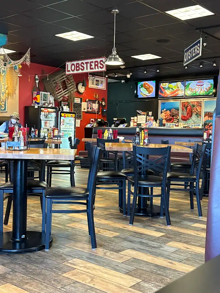 The Original Island Shrimp House Lobsters and seafood restaurant interior with tables and colorful decor.