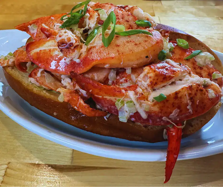 Lobster Roll at The Original Island Shrimp House Lobster roll topped with lobster claw meat and scallions at The Original Island Shrimp House in Palos Park, IL